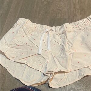 The North Face Cream Shorts with Pink Floral Accents